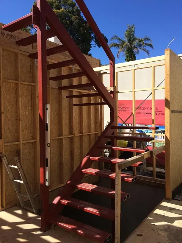 Fabricated structural steel staircase installed during construction