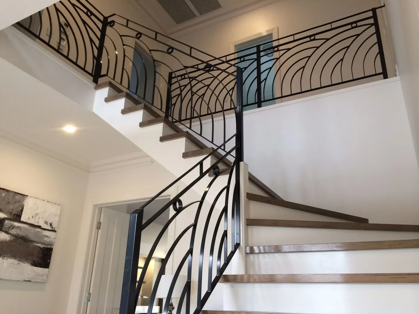 Curved decorative wrought iron staircase balustrade